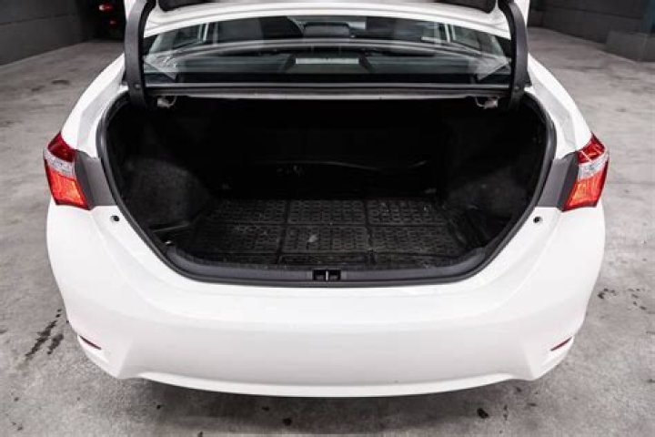 How do you get into the trunk of a toyota corolla